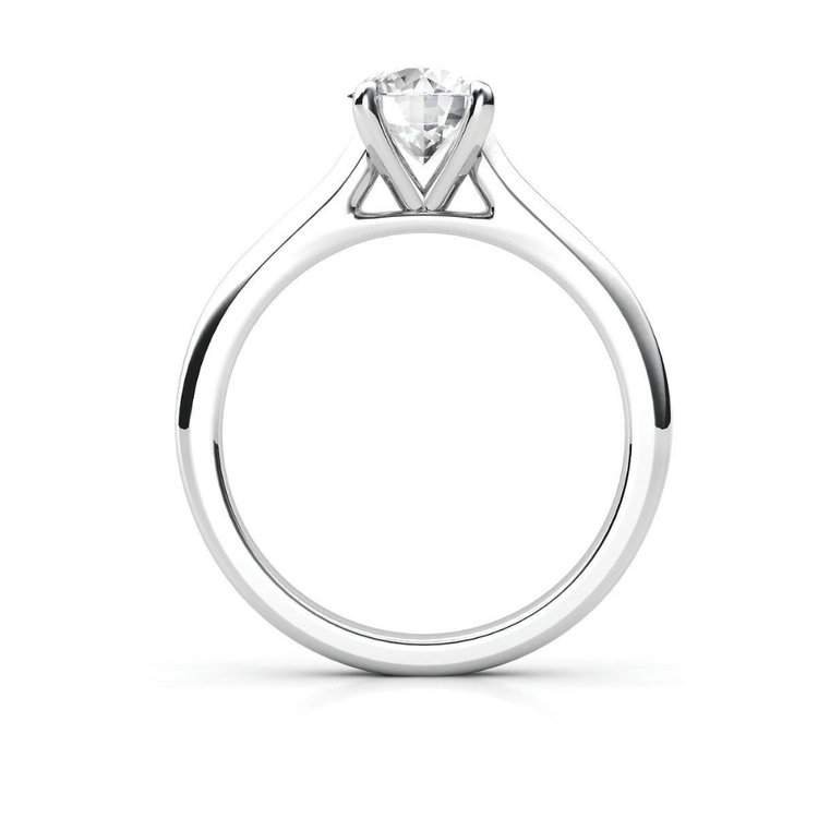 A Classic Round Solitaire Lab Grown Diamond Engagement Ring in white gold or platinum, featuring an elegant prong setting, displayed on a white background.