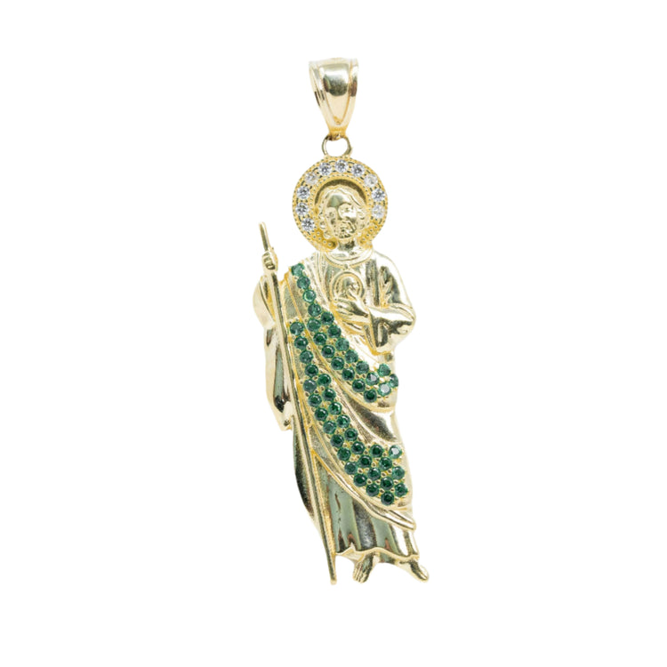 The Saint Jude Pendant in 14K Yellow Gold – Green CZ Brilliance for Men showcases a robed saint with green and clear stones, staff and medallion, and a circular halo accented by sparkling gems near the head.