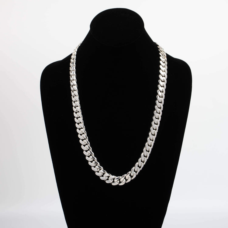 The 18mm Handmade Miami Cuban Link Chain in 950 silver is displayed on a black velvet bust stand against a white background.