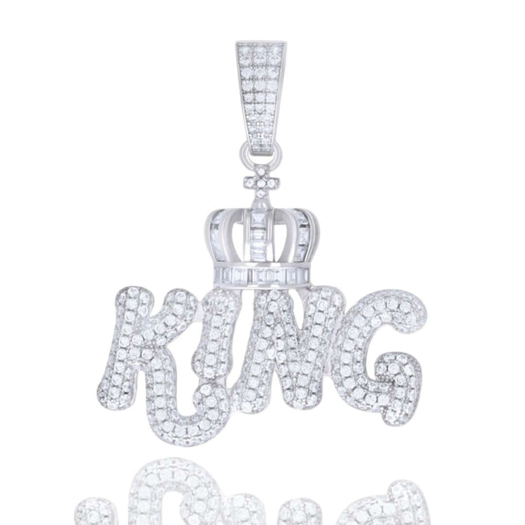 The Silver Moissanite King Charm Pendant showcases bold "KING" letters, a diamond-encrusted crown motif, and a sparkling bail, all crafted from 925 sterling silver for your chain or necklace.