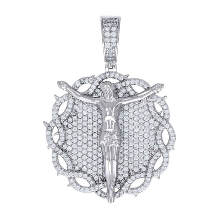 The Silver Round Moissanite Crucifix Charm Pendant showcases Jesus with outstretched arms on a round, VVS moissanite-studded backdrop framed by thorns. Its bail is also adorned with sparkling moissanite stones.
