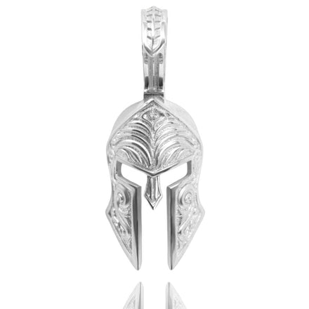 The Silver Spartan Helmet Pendant features intricate engravings and a top loop, making it a bold piece of warrior jewelry or a striking ancient helmet pendant.