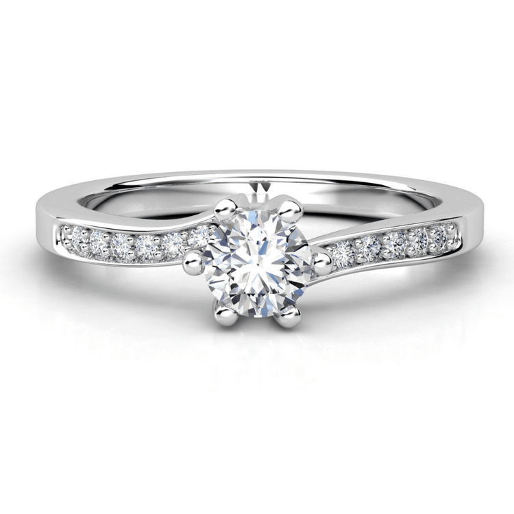 The Six-Prong Round Lab Diamond Solitaire Engagement Ring with Pave Accents features a round lab diamond center stone set in white gold, highlighted by pavé-set diamonds along the band for added sparkle.