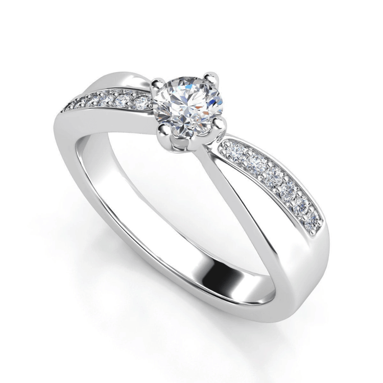 The Split-Band Lab Diamond Ring with Pavé Detailing features a round lab-grown diamond in a four-prong setting, with accent stones on the split shank—an elegant choice for women's engagement.