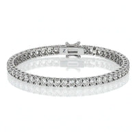 The Tennis Bracelet - 925 Silver Moissanite features a continuous row of sparkling moissanite stones in classic prong settings, elegantly showcased on a white background.