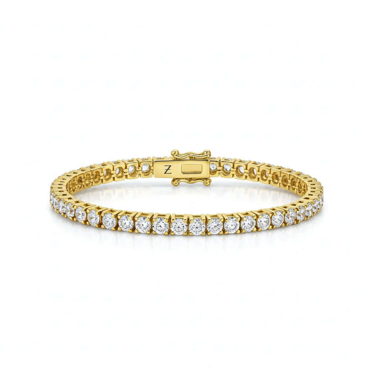 The Tennis Bracelet - 14k Gold Natural Diamonds showcases a single row of round white diamonds set in gold links, offering elegant luxury against a simple white background.