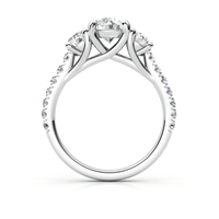 The Three-Stone Lab Diamond Engagement Ring - Elegant Trio in White Gold features three round lab diamonds in prongs, a twisted band with diamond-accented shoulders, and a side view for an elegant women’s engagement ring choice.