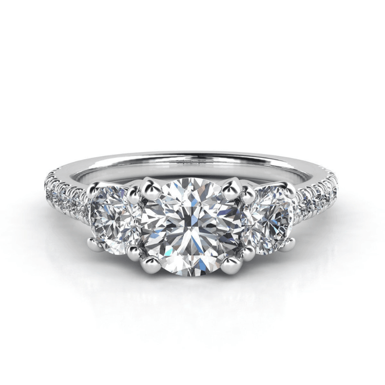 The Three-Stone Lab Diamond Engagement Ring - Elegant Trio in White Gold features a brilliant round center stone, two side diamonds, and sparkling accents along the band—an elegant, timeless choice for a women's engagement ring.