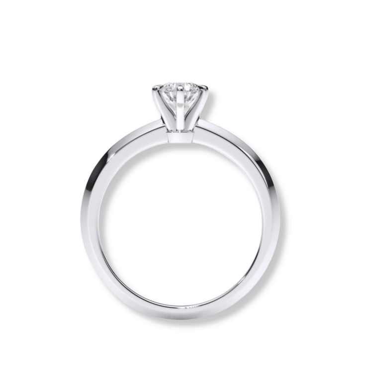 The Timeless Six-Prong Solitaire Lab Diamond Ring features a round lab diamond in a polished white band, viewed from the side against a white background—a classic women’s engagement ring.