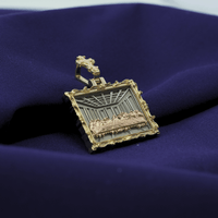 The Tricolor Last Supper Pendant – 14K Gold Men Pendant features a detailed rectangular design with an ornate border, resting on deep purple fabric. This striking piece is ideal for those seeking unique Last Supper jewelry.