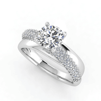The Triple Row Pavé Band Lab Diamond Engagement Ring with Round Center features a white gold setting and lab diamonds, paired with a matching wedding band.