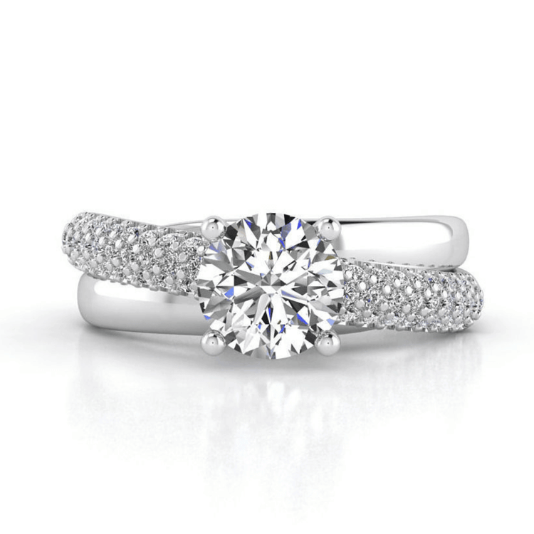 The Triple Row Pavé Band Lab Diamond Engagement Ring with Round Center in white gold, featuring a bold round lab diamond and pavé band, is displayed against a plain white background.