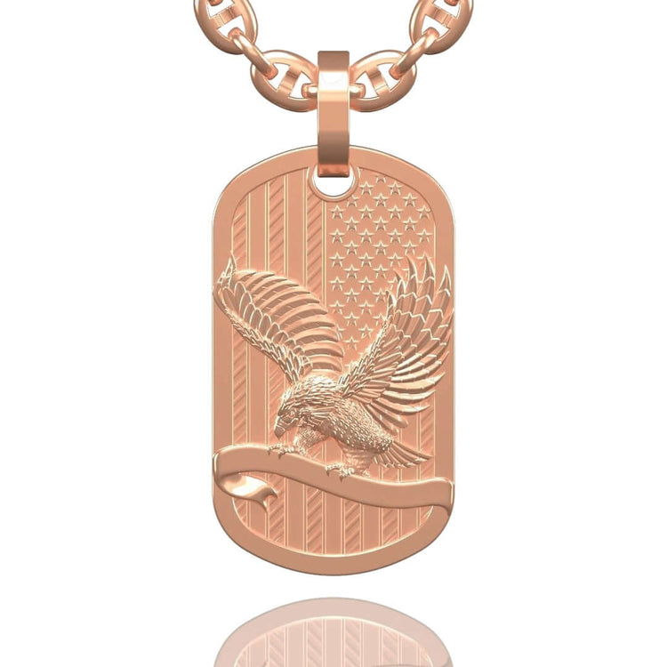 The US Flag & Eagle Tag Pendant – 14K Gold Men Pendant features an American flag background and a detailed eagle with outstretched wings, all crafted in 14K gold and hanging from a matching chain.