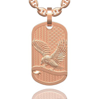The US Flag & Eagle Tag Pendant – 14K Gold Men Pendant features an American flag background and a detailed eagle with outstretched wings, all crafted in 14K gold and hanging from a matching chain.