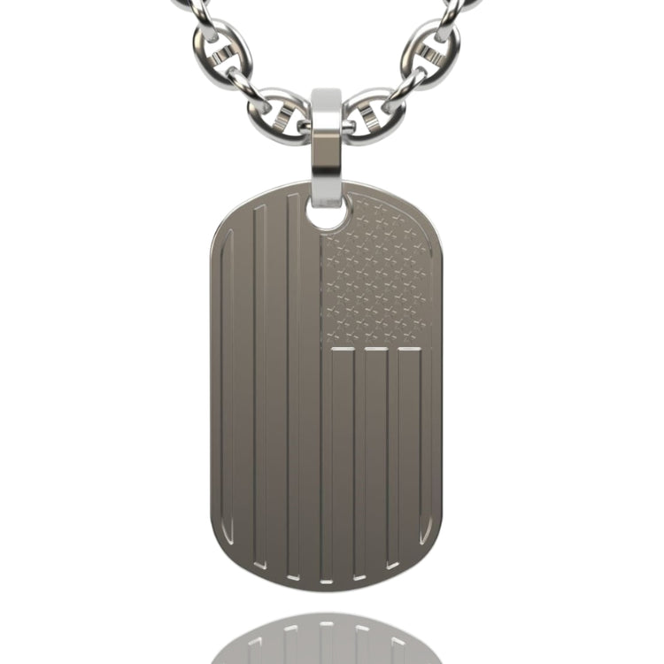 The USA Flag Tag Pendant features an engraved stars-and-stripes design on a silver tag with a metal chain—perfect for those seeking classic patriotic jewelry or a stylish USA flag pendant.