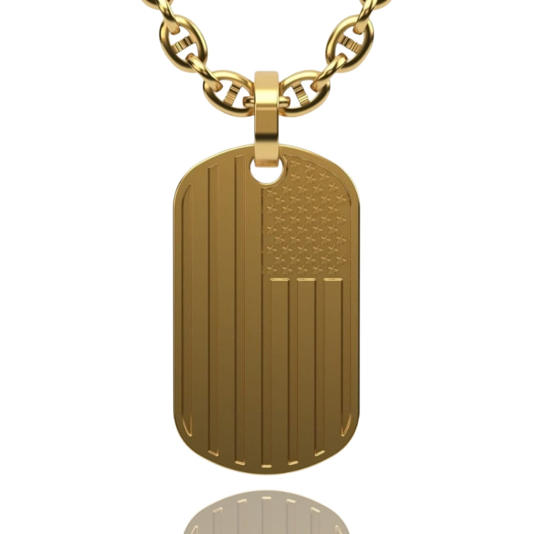 The USA Flag Tag Pendant features an engraved American flag design on a gold dog tag and hangs from a chunky gold chain, displayed against a white background.