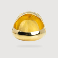 The USMC Eagle Globe and Anchor Ring – 14k Solid Gold is shown from the bottom, highlighting its polished inner surface and rounded edges against a plain light gray background.