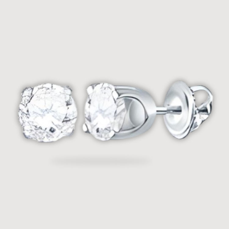 The 7/8CTW Unisex Round Cut Diamond Solitaire Stud Earrings in 14k white gold are shown on a light gray background, with one earring displaying the front and the other showing side and back views.