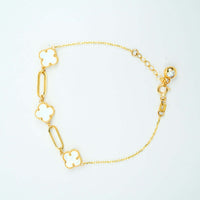 The 3 Leaf Clover Bracelet - 14k Yellow Gold features two white clover-leaf charms, elongated oval links, an adjustable clasp, and a small gold bead for a refined finish.