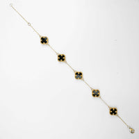 The 5 Leaf Clover Bracelet - 14k Yellow Gold features five black clover-shaped charms outlined in gold, evenly spaced along a delicate chain—an elegant accessory for everyday wear, shown here on a plain white background.