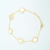 The 5 Leaf Clover Bracelet - 14k Yellow Gold features five white, four-leaf clover charms evenly spaced on a thin gold chain with a lobster clasp and adjustable links, offering timeless elegance for any occasion.