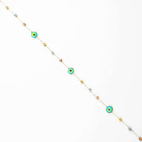 The 5 lucky eye bracelet - 14k is a delicate gold bracelet adorned with colorful spiritual protection charms and metallic beads, evenly spaced on a thin chain, shown diagonally on a white background.