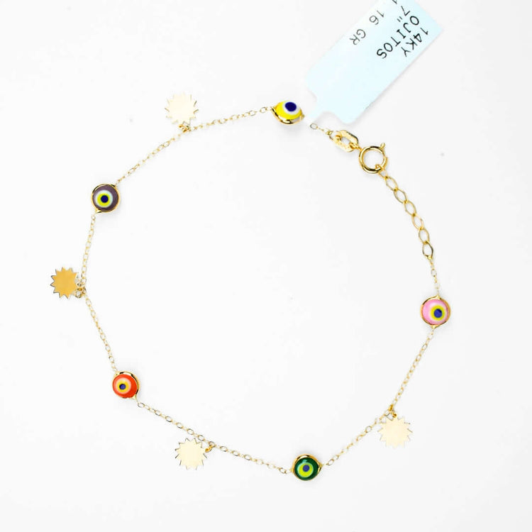 The 5 lucky eye bracelet - 14k is a delicate gold bracelet with colorful charms and sunburst pendants, offering spiritual protection. It features an adjustable clasp and comes with a product tag attached.