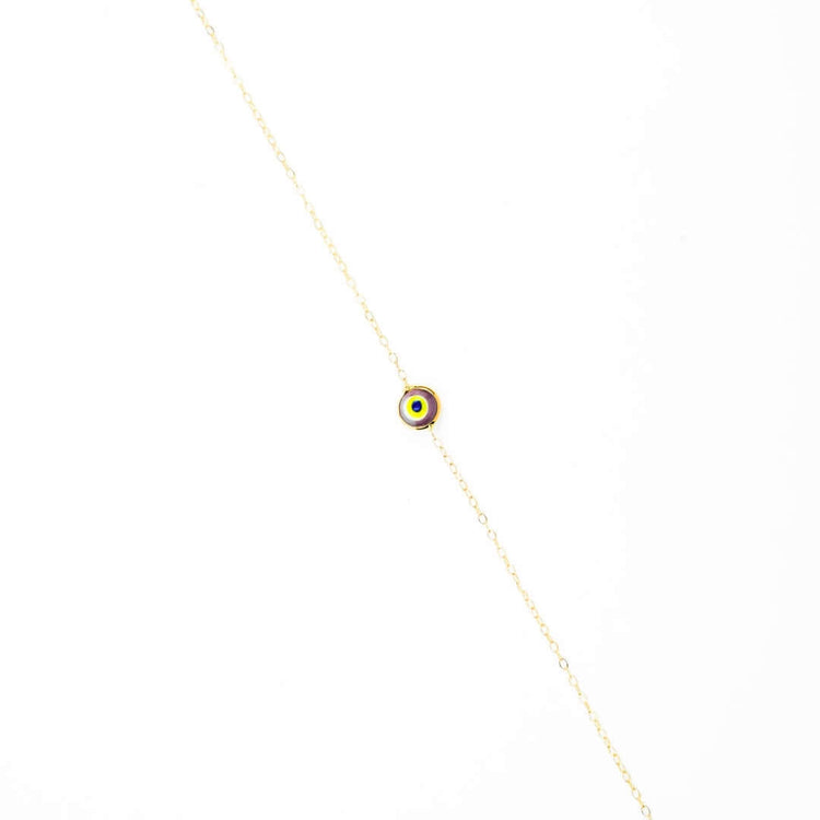 The one lucky eye bracelet - 14k features a small, circular multicolored evil eye charm at the center for spiritual protection, crafted in delicate 14k gold and displayed on a plain white background.
