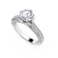The Vintage Milgrain Solitaire Lab Engagement Ring showcases a large round center diamond in a four-prong white gold setting with pavé band, split shank, and intricate vintage milgrain detailing.