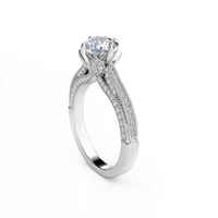 A Vintage Milgrain Solitaire Lab Engagement Ring with Pavé Diamond Band in white gold, featuring a round brilliant-cut solitaire and intricate pavé accents, photographed on a plain white background.