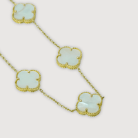 The 5 Leaf Clover Bracelet in 14k yellow gold features clover-shaped pendants with white mother-of-pearl inlays, each bordered by delicate gold beading, evoking a lucky charm motif and shown against a simple white backdrop.