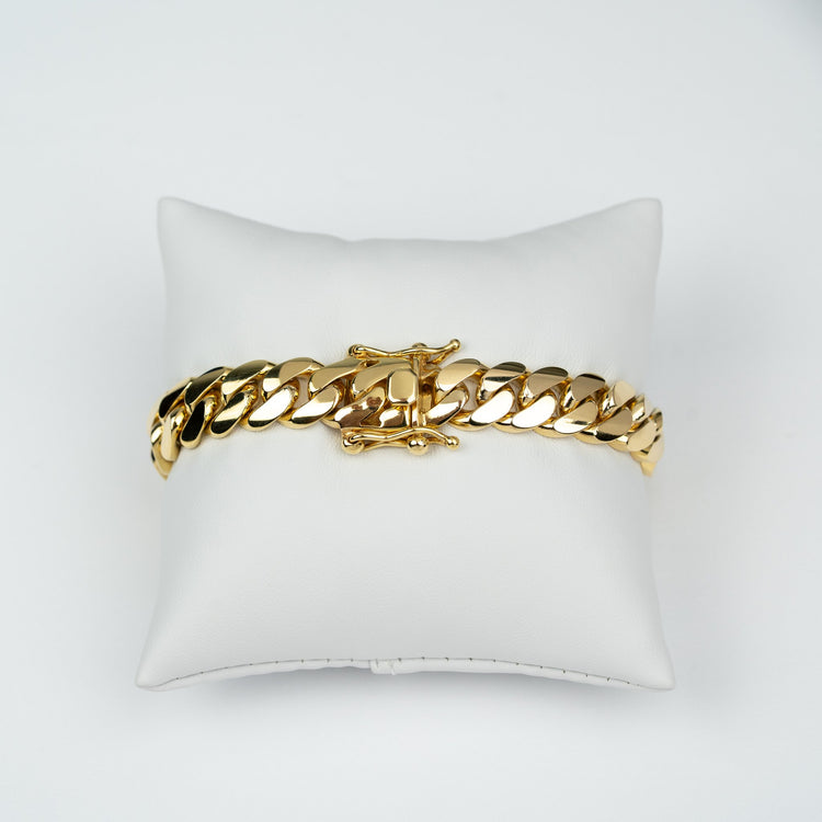 GOLDZENN 11mm handmade Miami Cuban link bracelet in solid yellow gold, showing the hand-made box lock with dual figure-8 safety latches.