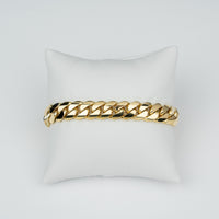 11mm handmade Miami Cuban link bracelet in solid yellow gold, showing the tight, hand-finished Cuban link work.