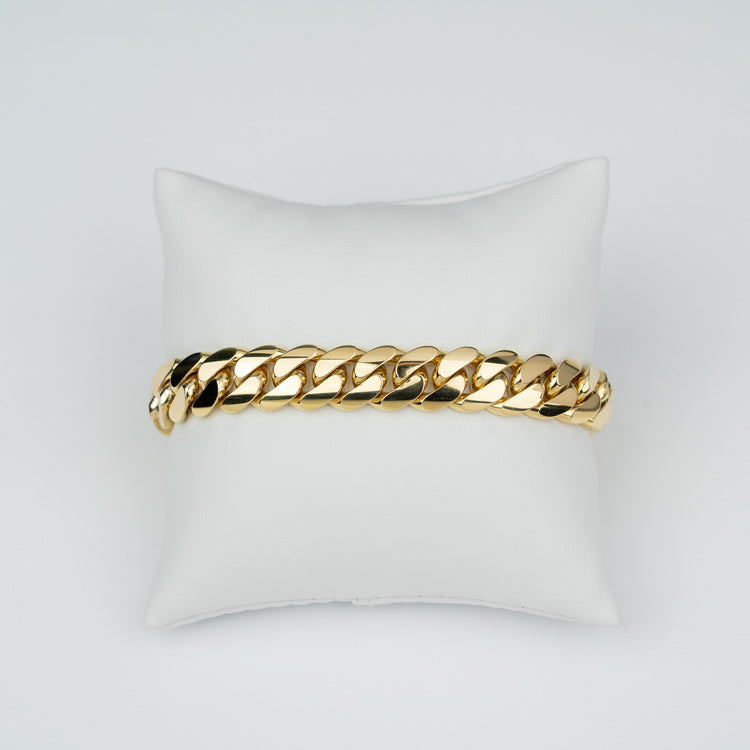 11mm handmade Miami Cuban link bracelet in solid yellow gold, showing the tight, hand-finished Cuban link work.