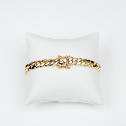 GOLDZENN 8mm handmade Miami Cuban link bracelet in solid yellow gold, showing the hand-made box lock with dual figure-8 safety latches.