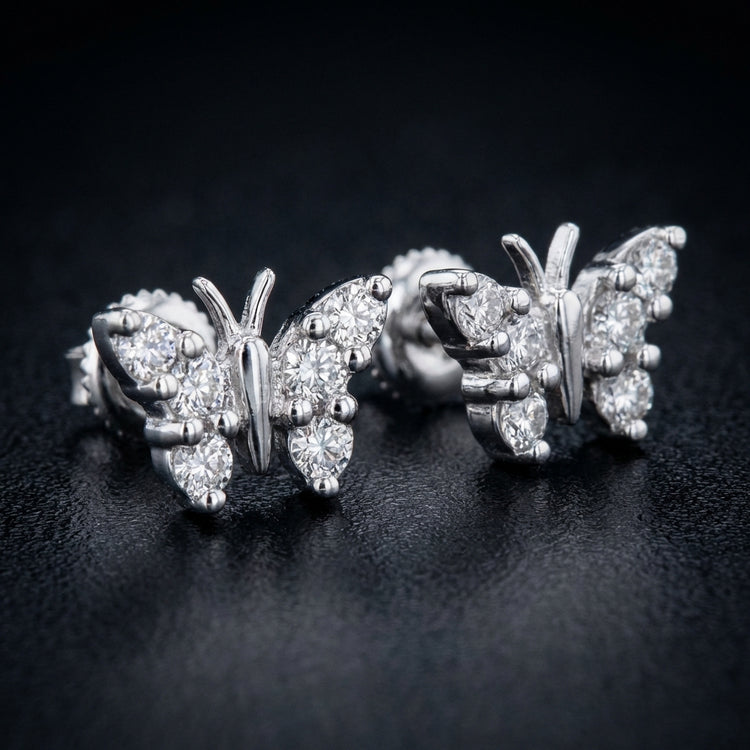 10k White Gold Diamond Butterfly Earrings 1/5 Cttw three-quarter view - GOLDZENN