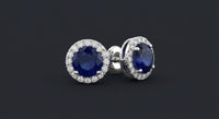 1-1/5CTW Round Blue Sapphire Diamond Halo Stud Earrings – 14K White Gold three-quarter view - GOLDZENN