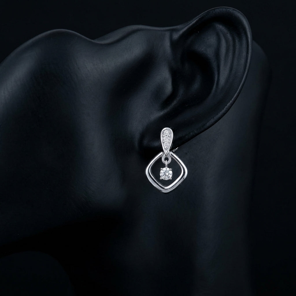 1/10CT Natural Diamond Earrings in Sterling Silver displayed on ear - GOLDZENN