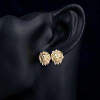 1/12CTW Round Diamond Lion Face Stud Earrings - 10K Yellow Gold displayed on ear - GOLDZENN