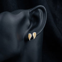 1/10 CTW Natural Diamond Wing Earrings displayed on ear - GOLDZENN