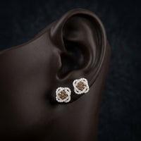 10k Yellow Gold Cognac Diamond Flower Earrings 5/8 Cttw displayed on ear - GOLDZENN
