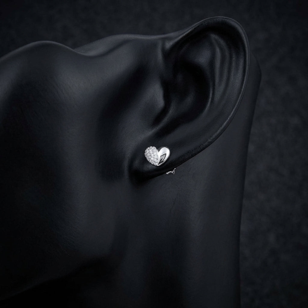 1/10CT Diamond Heart Earrings – Sterling Silver displayed on ear - GOLDZENN