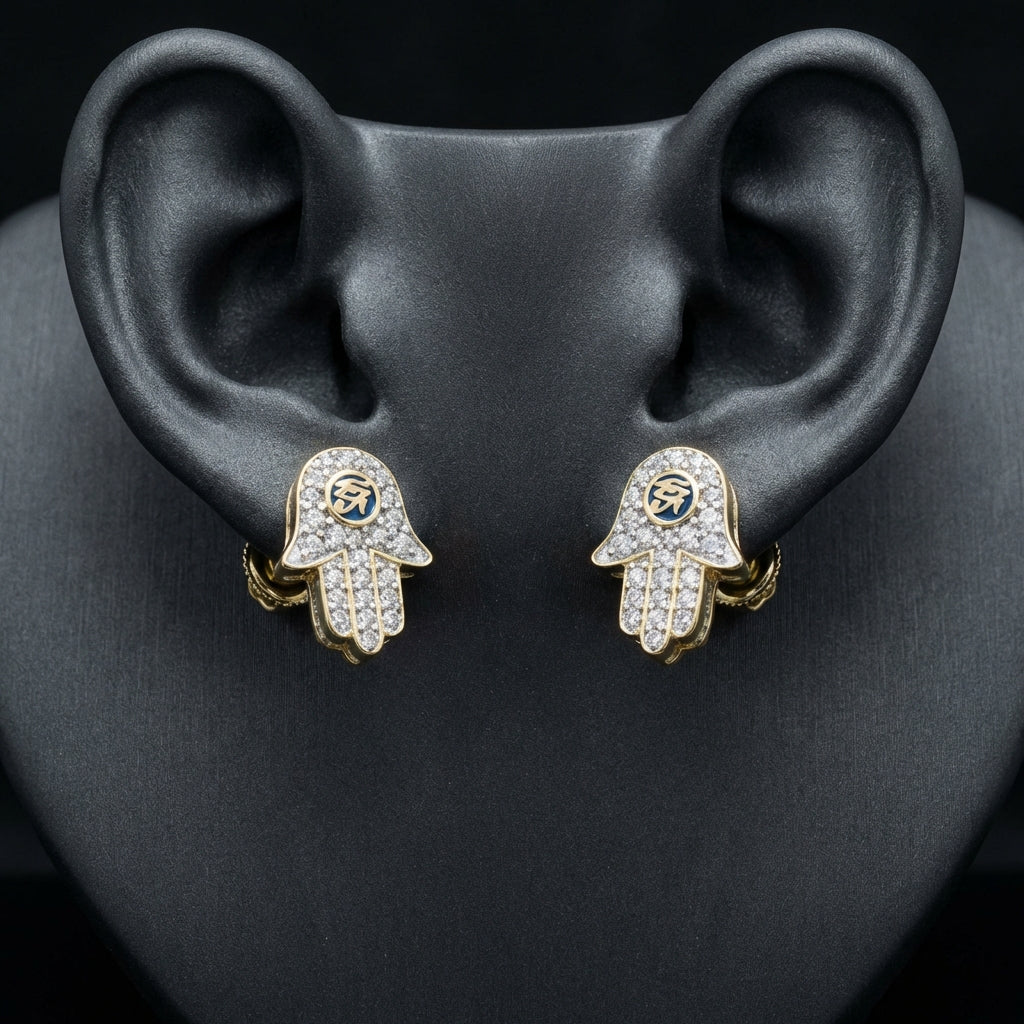10k Gold Baguette Diamond Hamsa Eye Earrings displayed on ear - GOLDZENN