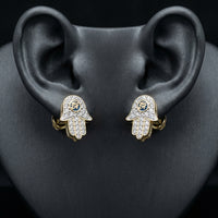 10k Gold Baguette Diamond Hamsa Eye Earrings displayed on ear - GOLDZENN