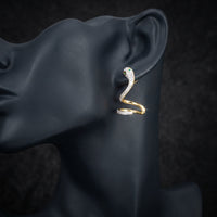 3/4CTW Diamond & Emerald Snake Earring 14k Gold displayed on ear - GOLDZENN