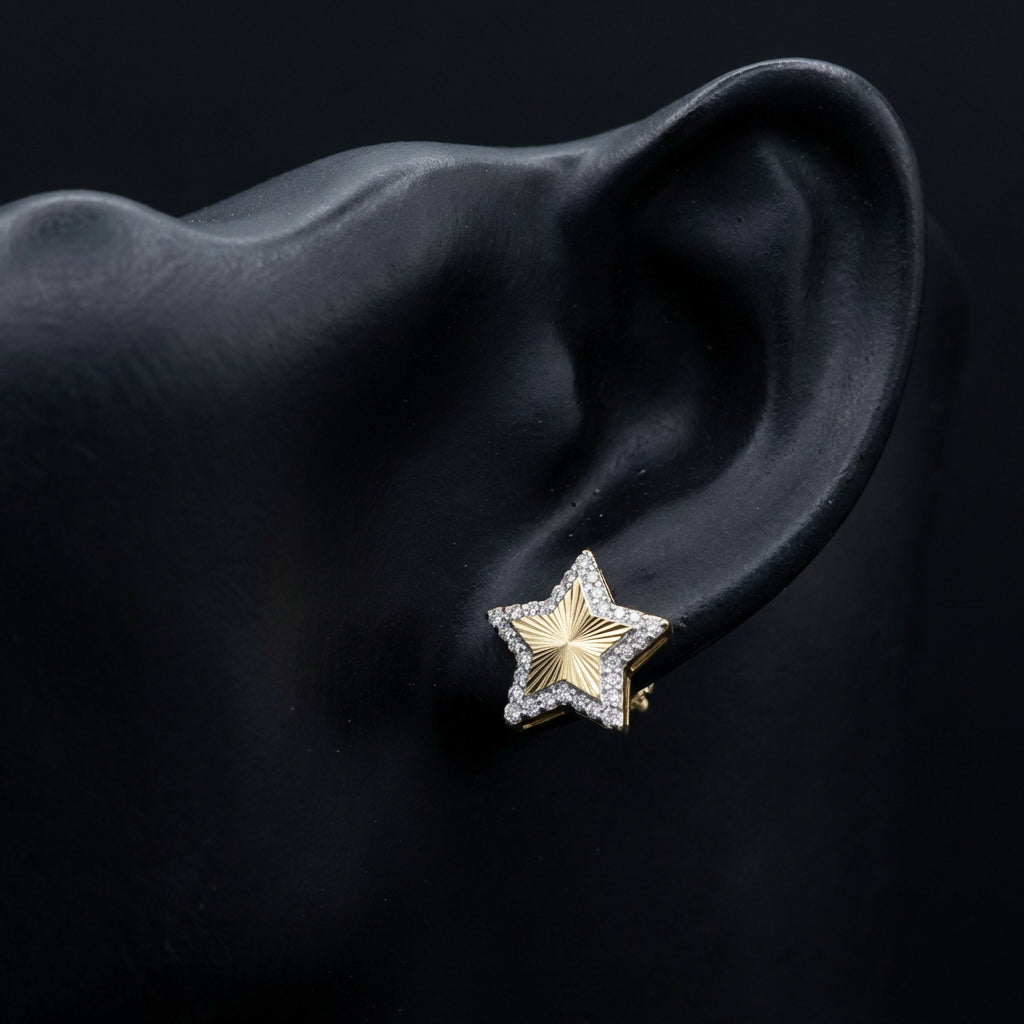 1/4CTW Natural Diamond Star Earrings 10K Yellow Gold displayed on ear - GOLDZENN