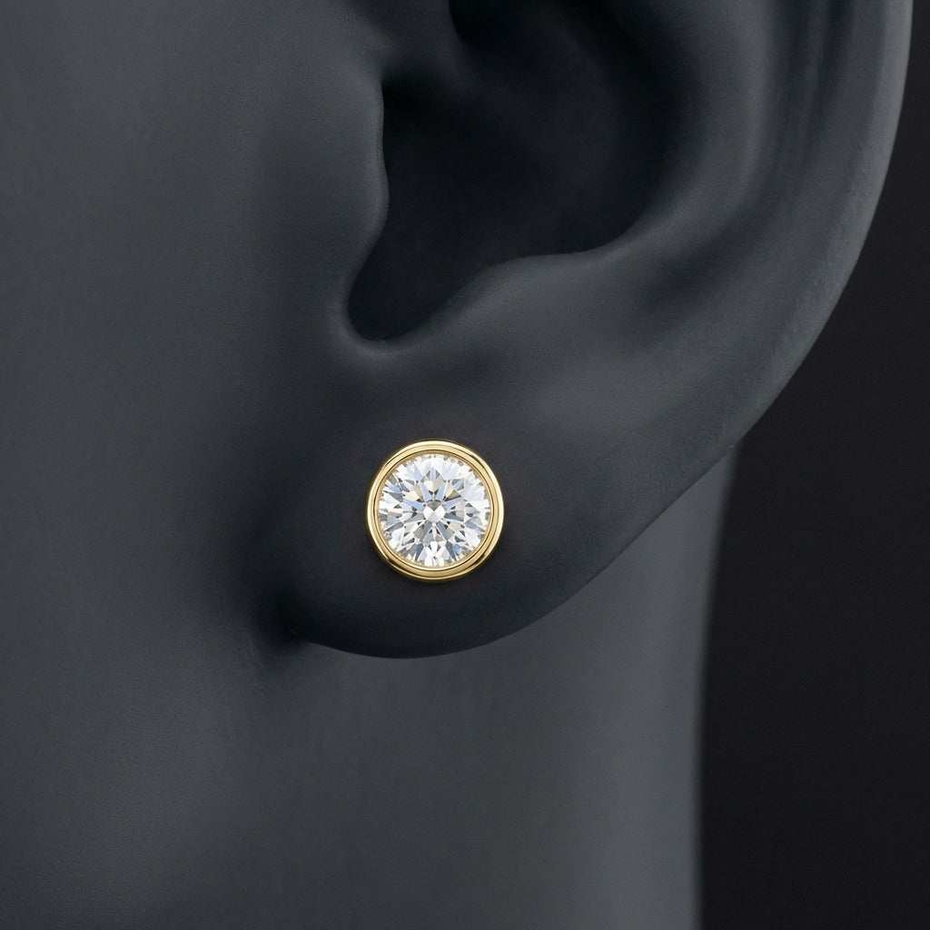 1/2CTW Diamond Solitaire Stud Earring 14K Gold displayed on ear - GOLDZENN