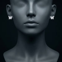 10k White Gold Diamond Butterfly Earrings 1/5 Cttw displayed on ear - GOLDZENN