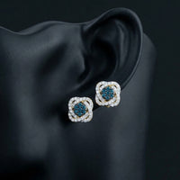 5/8CT Blue Diamond Flower Earrings in 10k Gold displayed on ear - GOLDZENN
