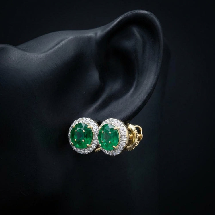 14K Yellow Gold Diamond & Emerald Gem Earrings displayed on ear - GOLDZENN